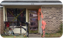 Caution tape covers the windows of a Pinewood Place residence.