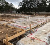 The foundation of Building 1 at Orange Ave is set.