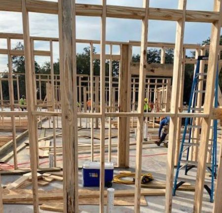 A construction site framing different rooms to be built.