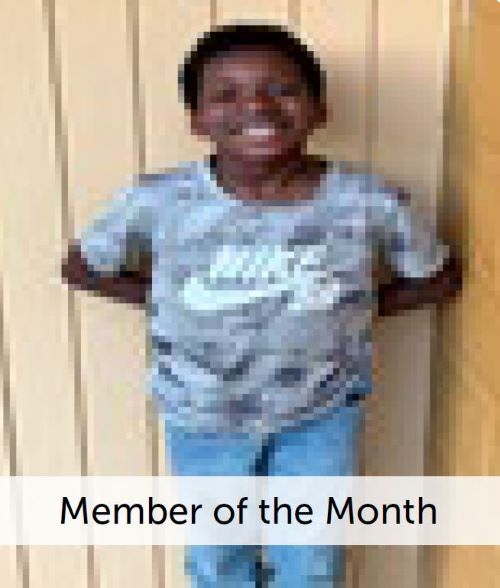 Member of the Month - M. Carter - A young boy smiling.