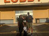 Family in front of a store. 
