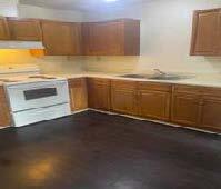 Renovated kitchen with stove and sink.