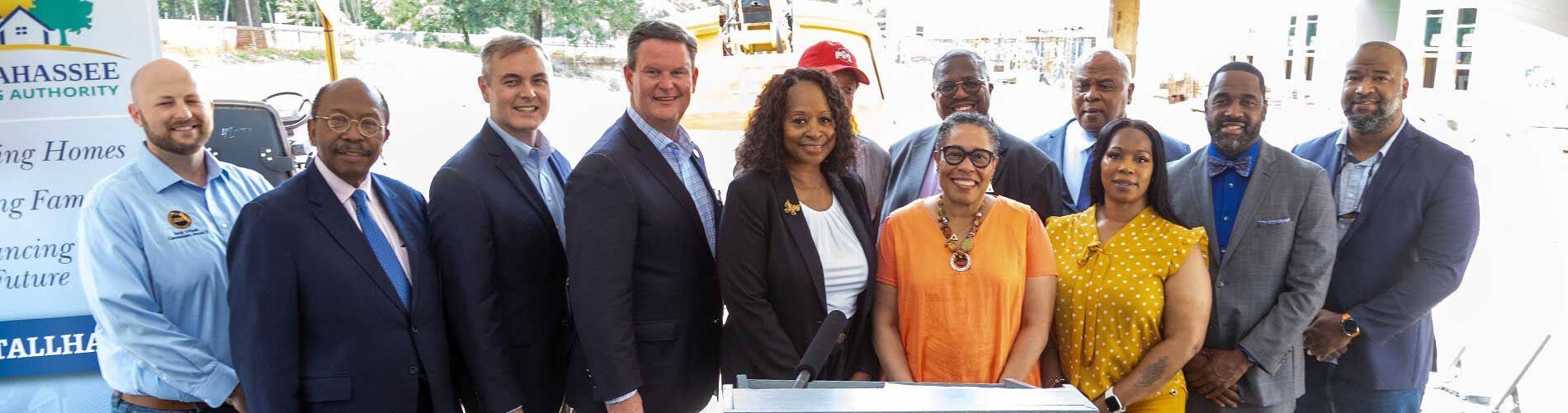 Group of people including HUD Secretary Marcia Fudge and Executive director Brenda Williams