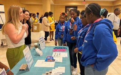 Career Day - Girls at a table learning about careers.