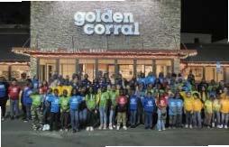 Group of youth standing in front of Golden Corral.