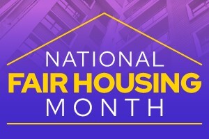 An apartment building in the background with text that reads National Fair Housing Month