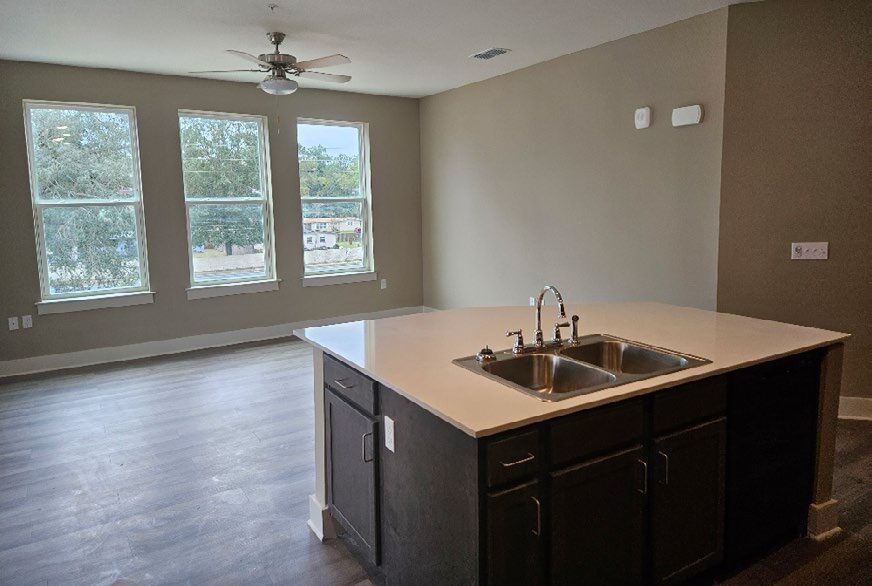 Finished interior of a kitchen shown.