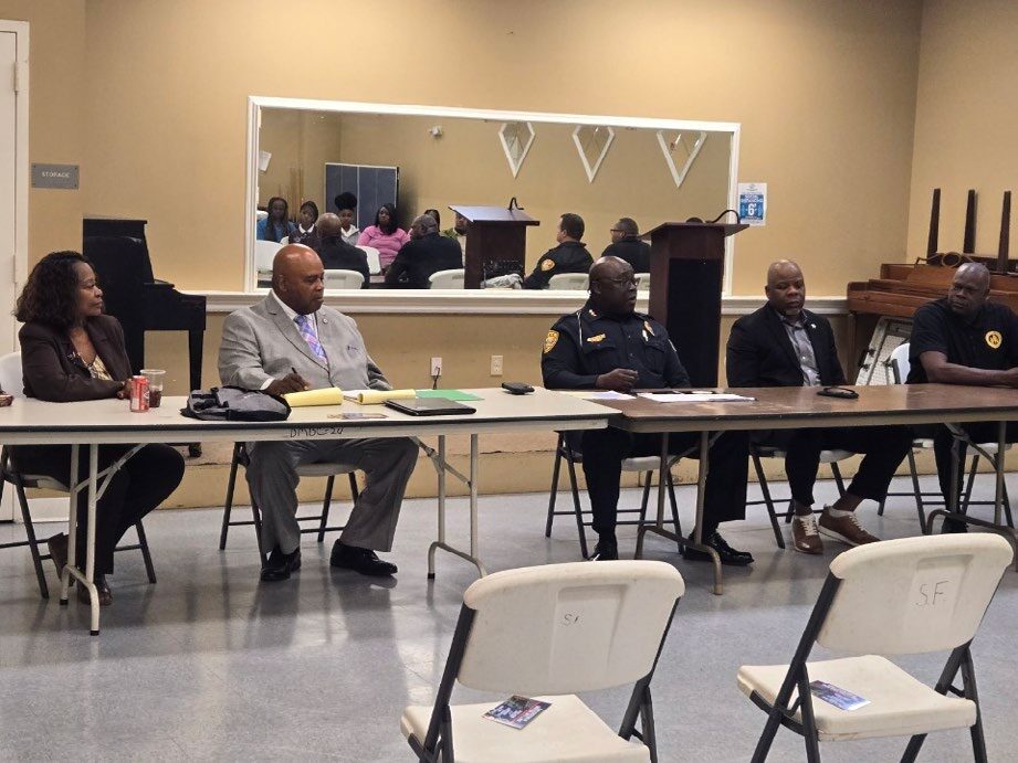 Group at a table discussing topics. 