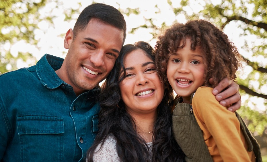 Three people smiling for a photo.