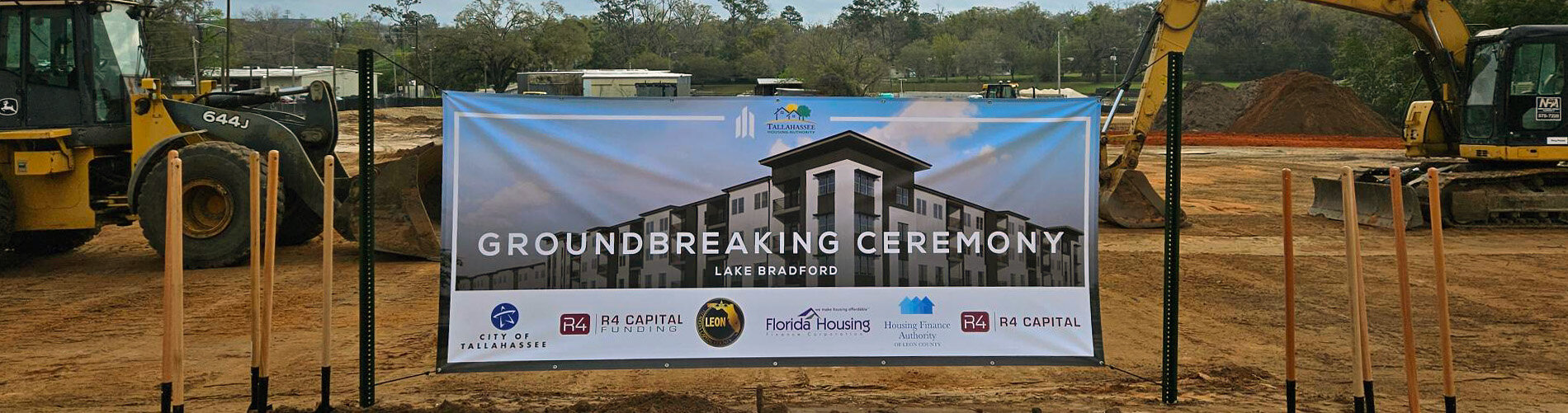 Photo of Bradford Groundbreaking-  New Affordable Community construction banner