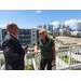 A man and a woman standing on the balcony and talking