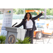 A woman gesturing behind a podium.