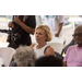 A woman with short hair listens intently. 