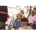 A woman looks directly at the speaker. 