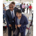 A man and a woman pose together in the crowd.