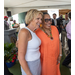 A side view of two ladies posing for a photo.