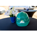 Hard hat on a table with flowers.