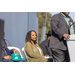 Woman on stage waiting to speak. 