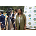 Woman in front of video camera smiling. 