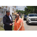 Marcia Fudge and a man in a suit having a conversation outside.