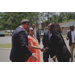 A woman shaking hands with Marcia Fudge.