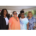 Four women standing together for a photograph.