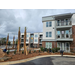 A view of palm trees next to apartments.