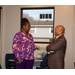 A man and a woman talking and smiling. 